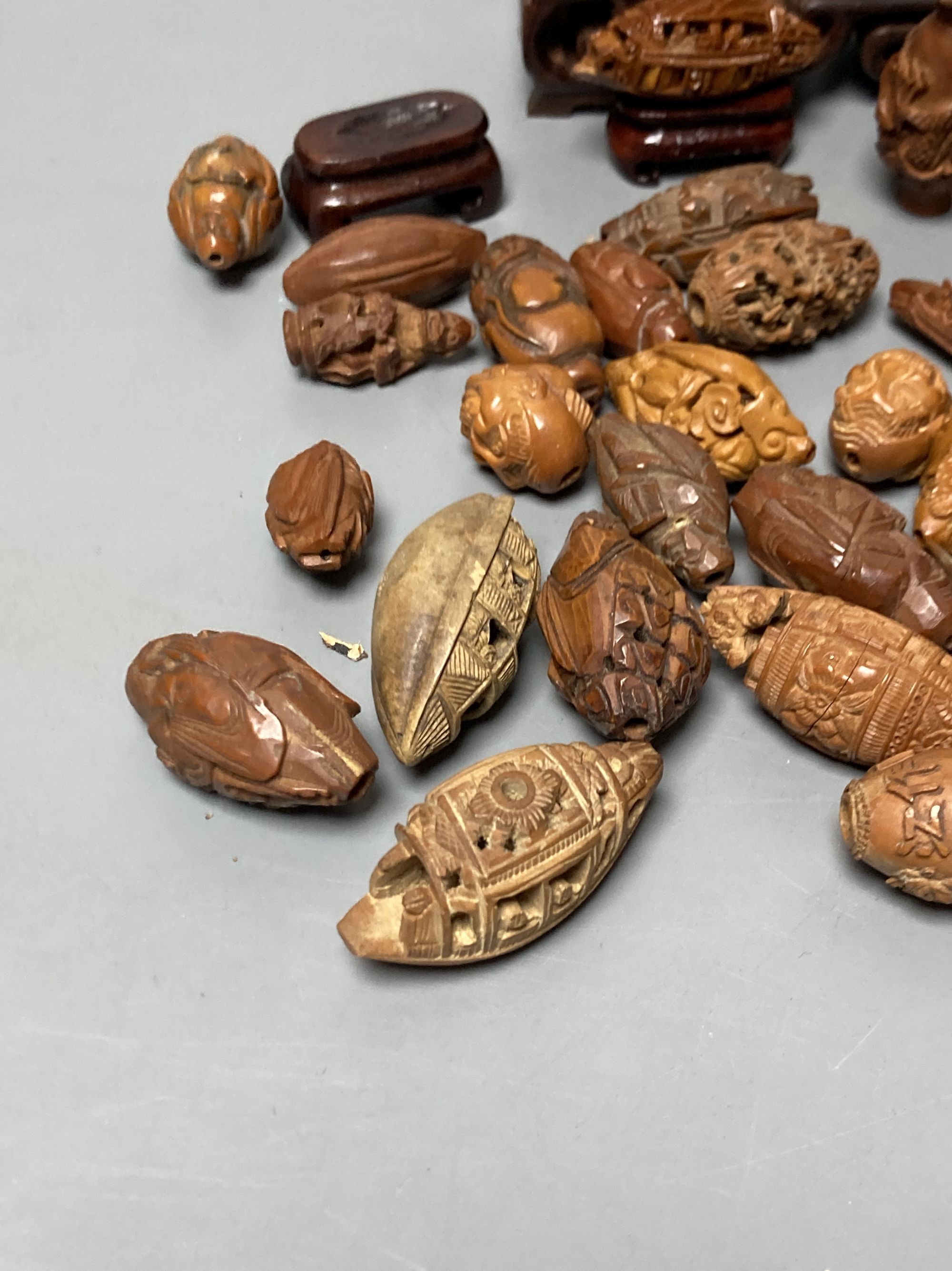 A group of Chinese peach stone carvings